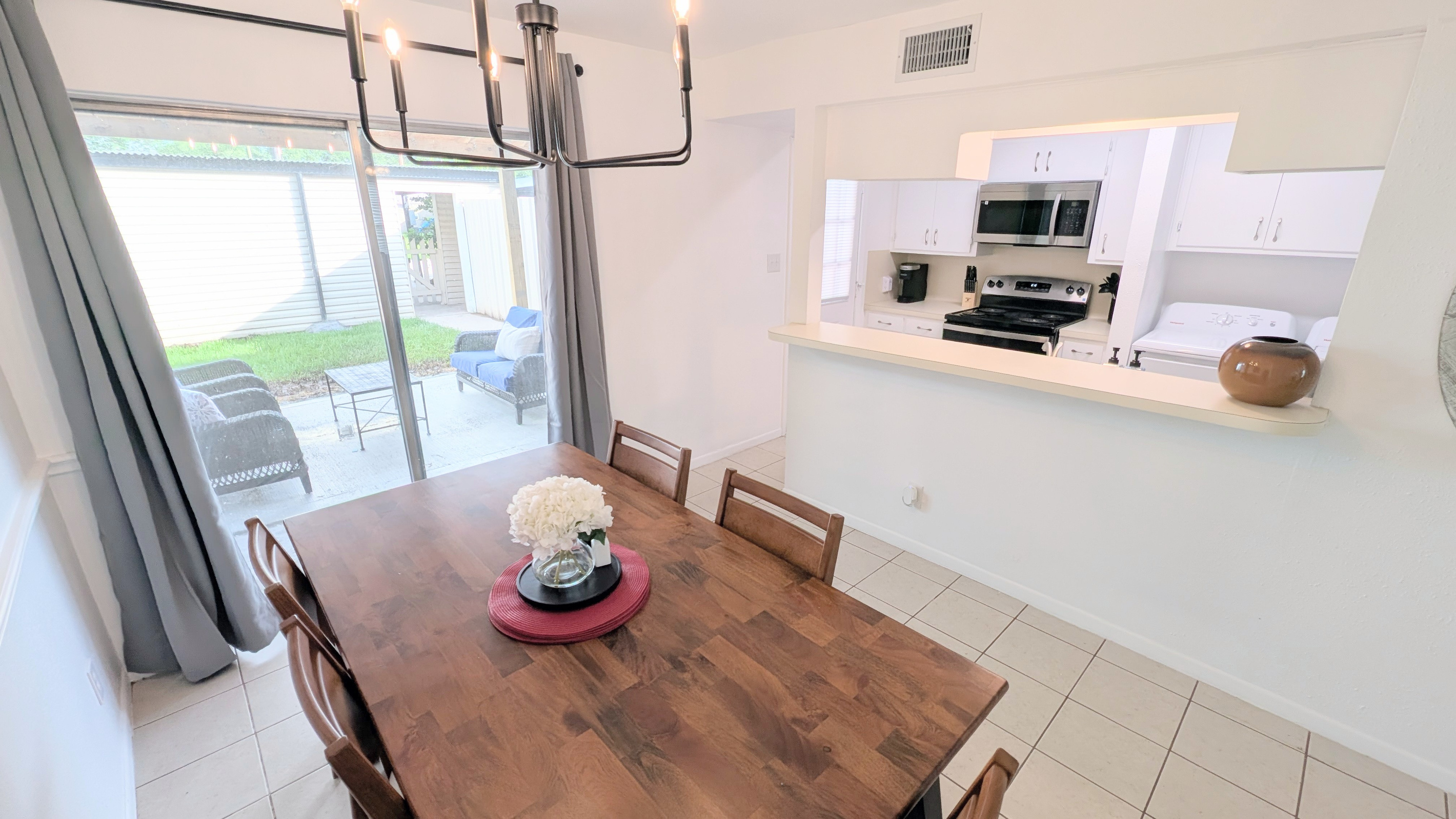 Dining room also has convenient access to the outdoor courtyard and galley kitchen.