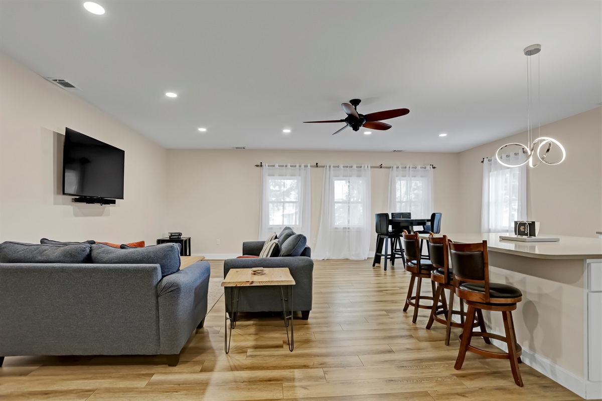 Experience effortless flow in this open-concept space where the living room, dining area, and kitchen come together for easy living and entertaining.