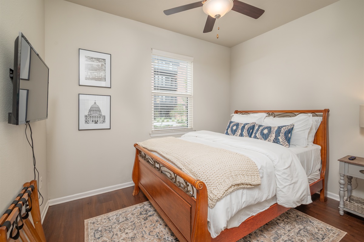 Cozy up in the queen bedroom with its own ensuite bath and TV — a perfect mix of comfort and privacy for your stay.