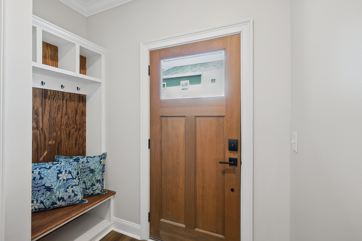 Built-in bench and hooks just inside the door, so you can drop your bags and settle in