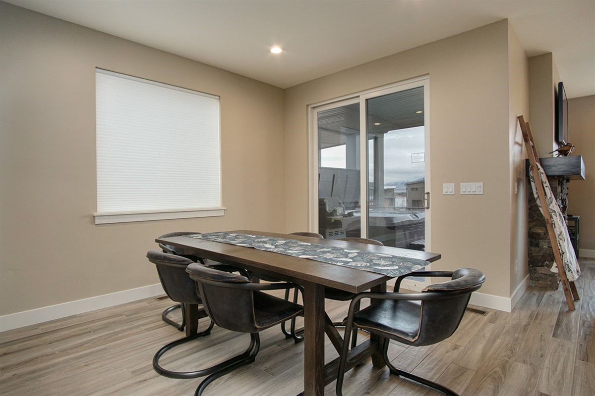 Dining area with seating for family meals and easy access to the outdoor deck.