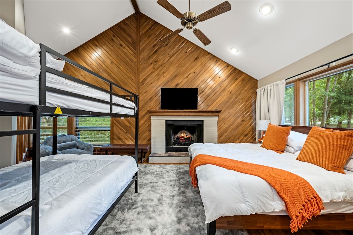 [Bedroom 4] - a king bed and a full bunk bed.  The fireplace doesn't use wood but has a electric log insert.