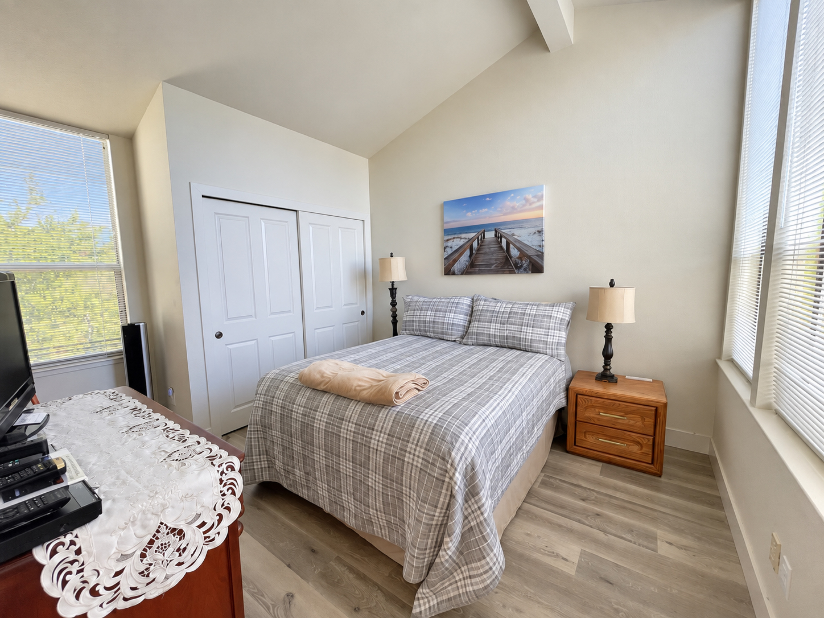 3rd Bedroom with Queen bed, vaulted ceilings and 3 large picture windows. Lots of natural lighting.