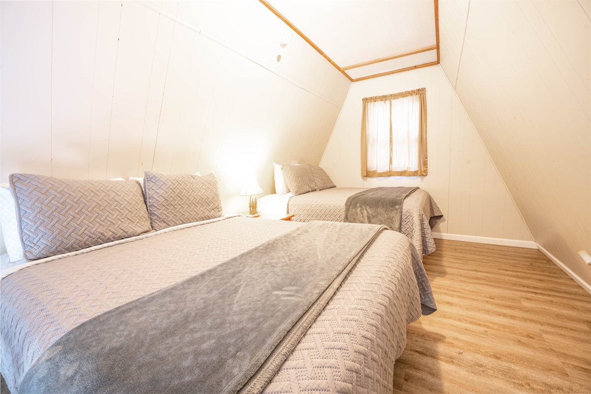 The loft level has 2 queen beds