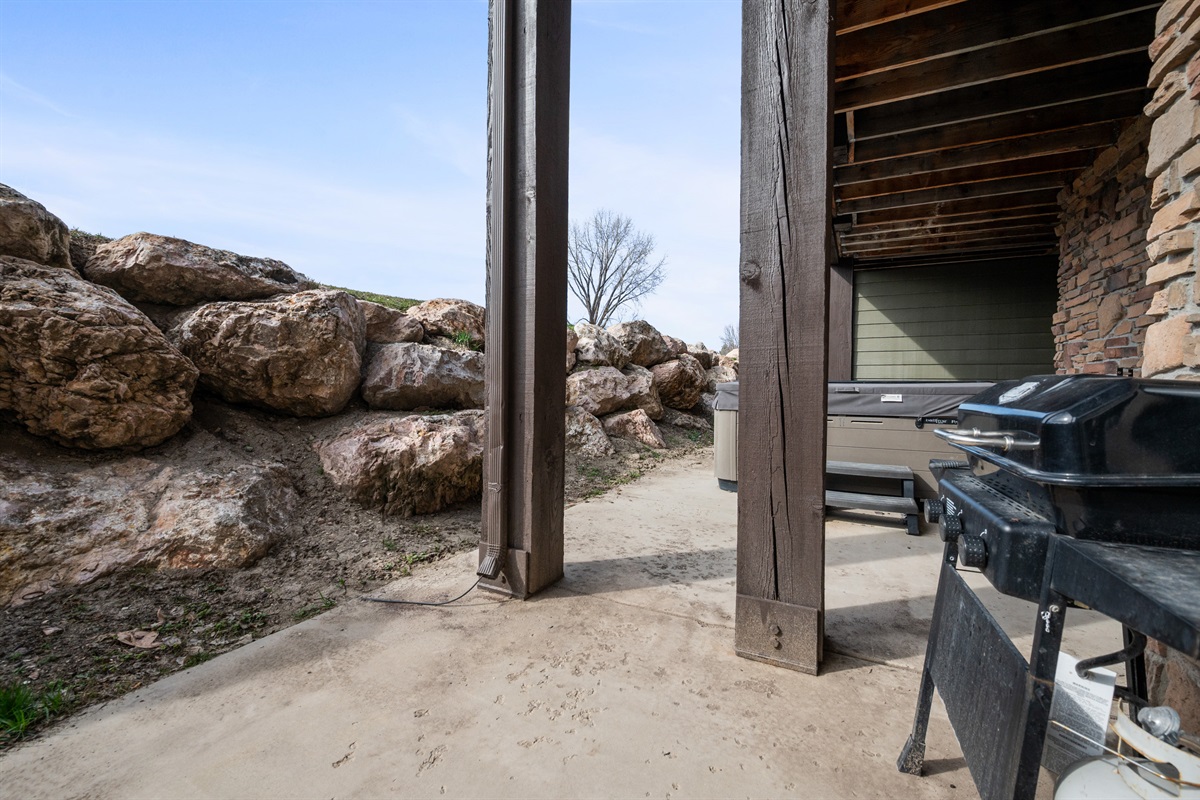 Private patio space with Hot Tub and BBQ grill for outdoor dining and relaxing evenings.