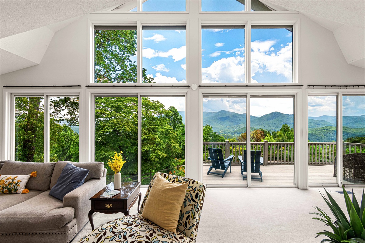 Living Room: Panoramic mountain views invite relaxation in this stylish, sun-soaked retreat!
