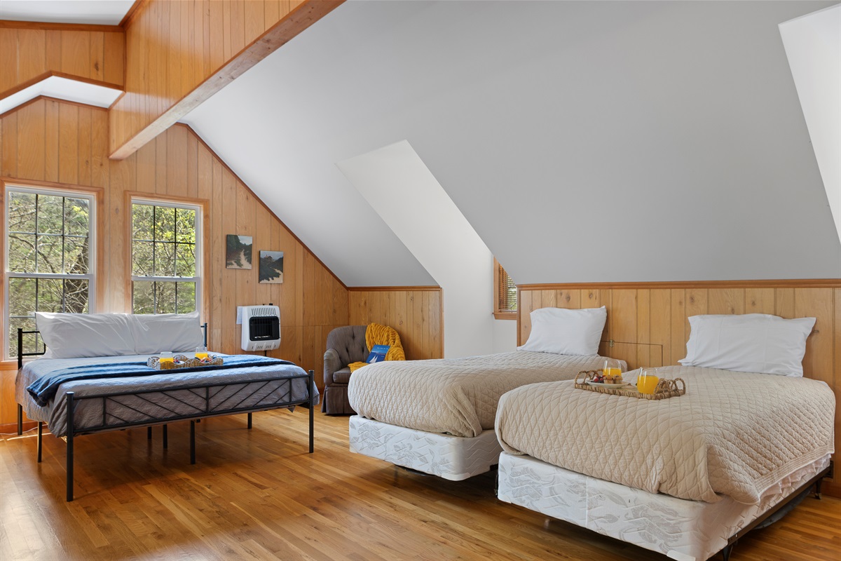 Queen Bedroom 3: Bright, airy loft with panoramic views and delightful decor awaits your stay!