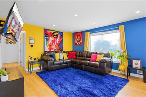 A living room bursting with color, offering a cheerful and welcoming atmosphere for relaxation and socializing