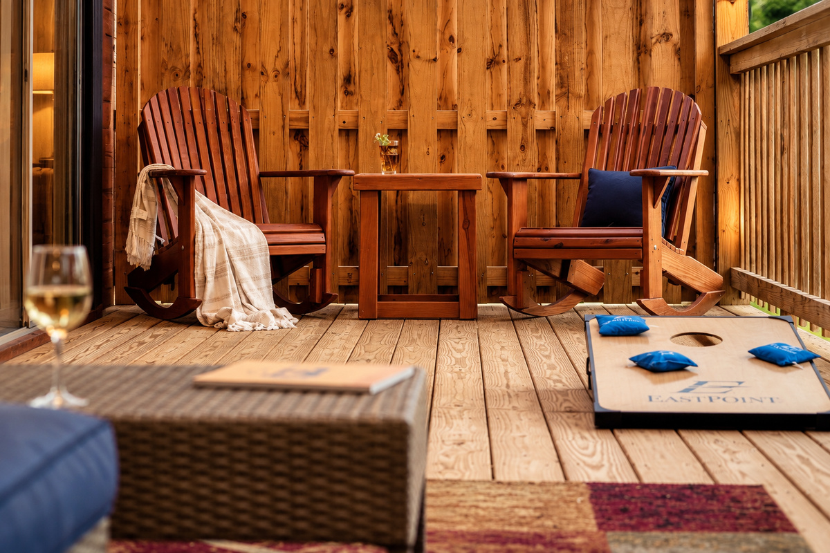 Settle into a pair of rocking chairs with a cold drink and a cozy throw.