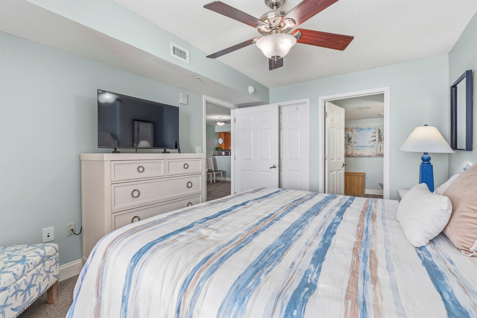 Primary Bedroom with King Bed, ensuite bathroom, and balcony with direct oceanview