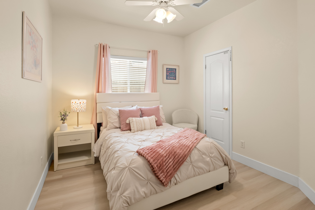 Drift off to sleep in this cozy and beautifully appointed bedroom featuring soft linens, calming décor, and a comfortable bed. Thoughtful touches throughout create a peaceful retreat where you can truly relax and recharge.