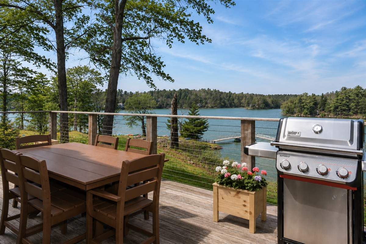 Back deck with grill and beautiful views of the cove 