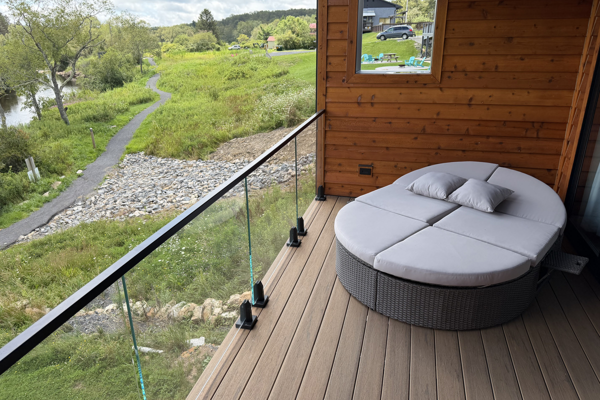 After an outside shower or tub soak, enjoy the private porch with chaise for two.