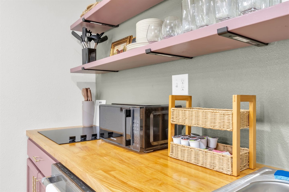 Fully stocked kitchen featuring a 4-burner electric stove, oven, microwave, Keurig with pods, and all the cookware and glassware you’ll need.