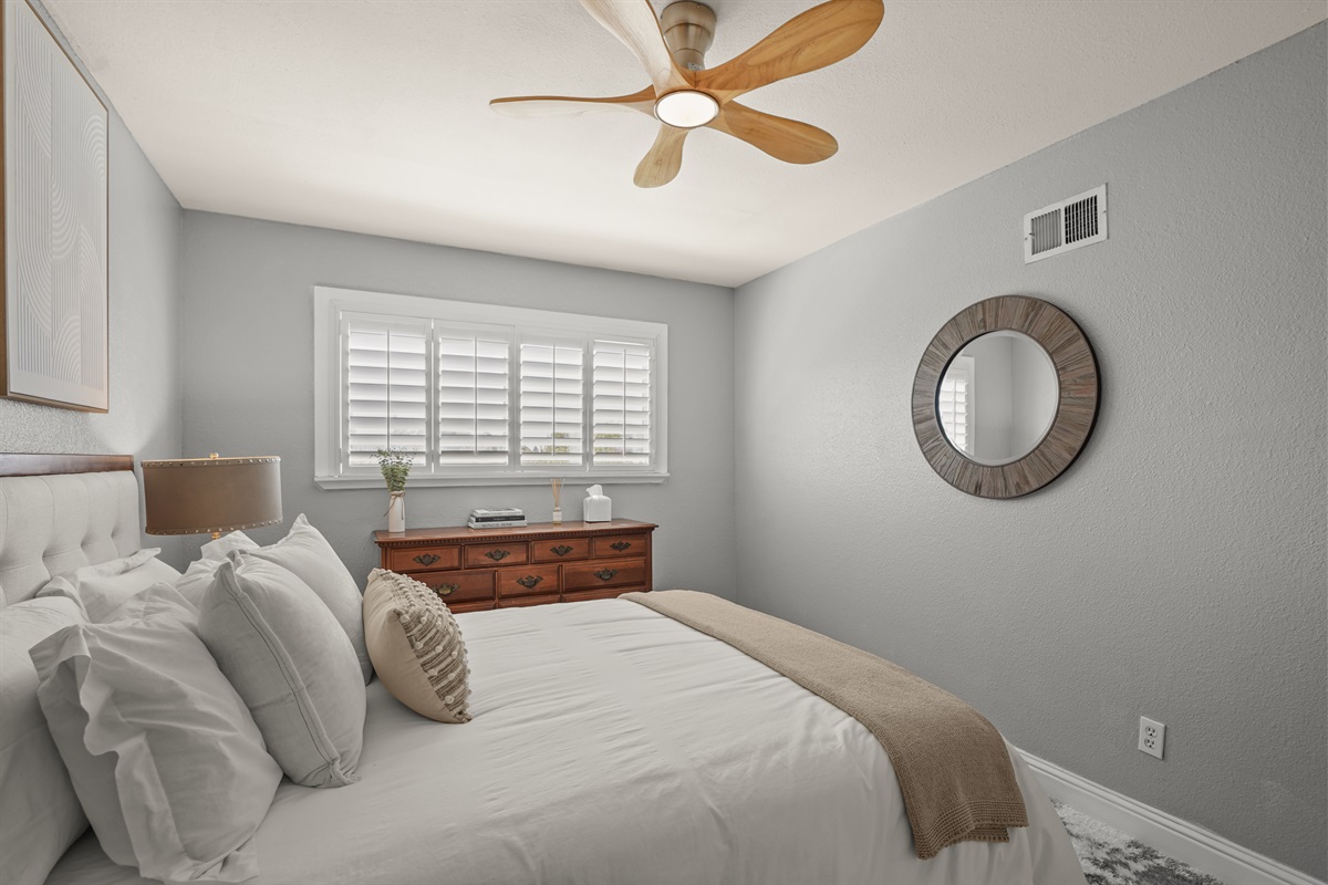 Cozy upstairs bedroom with a queen bed and relaxing atmosphere.
