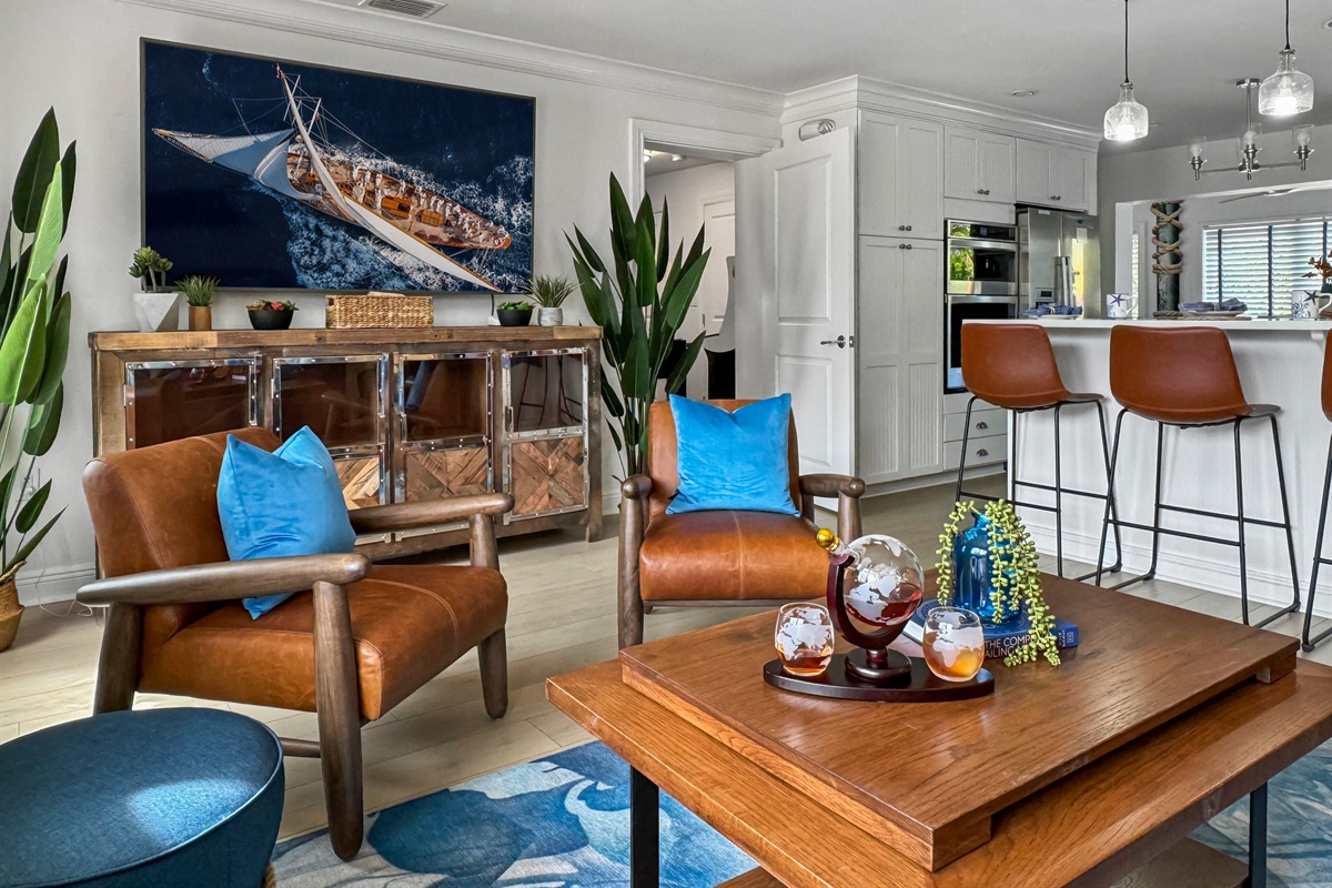 Chic living area opens to a gourmet kitchen.