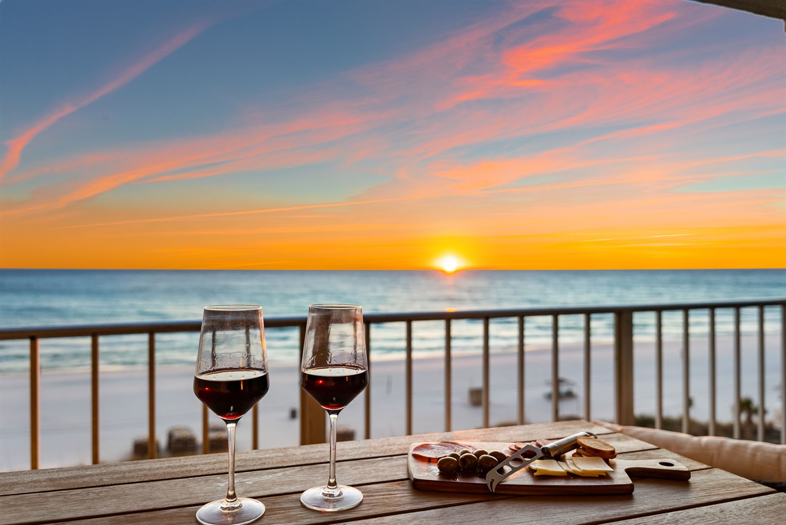 Watch the dreamy sunset from your private balcony with table space and separate comfy chairs