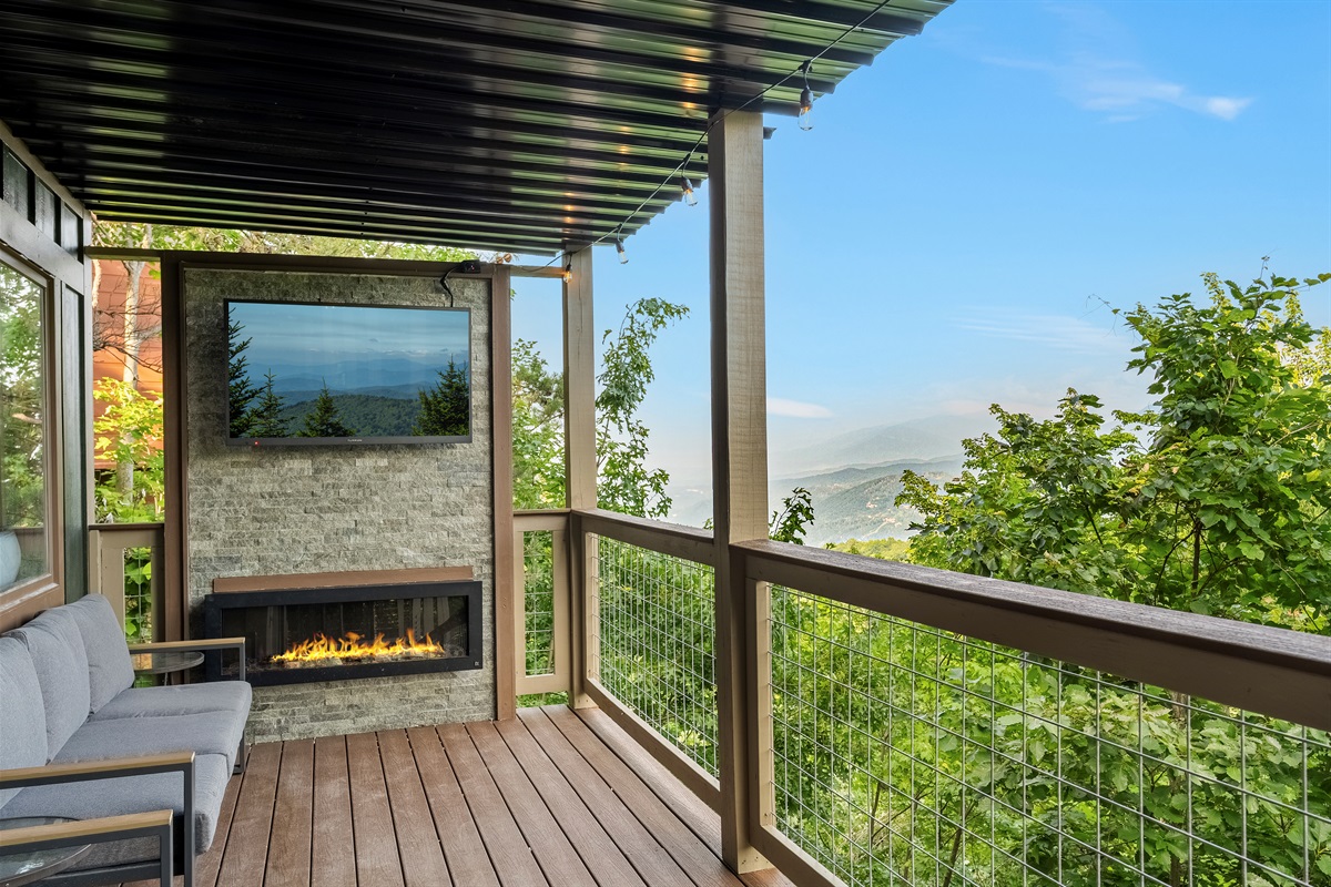 Beautiful outdoor electric fireplace and TV with views for miles!