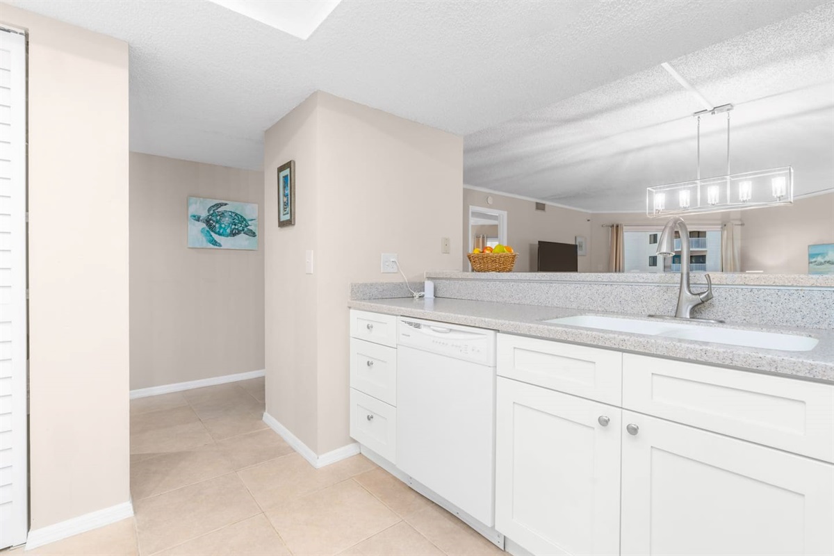 Fully stocked custom kitchen open to the living room. 