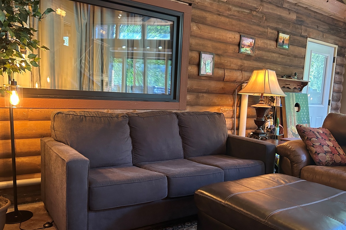 Window above couch can be curtained off or opened for for open line of sight to the Guest Quarters. The door to the Guest Quarters also has blinds that can be opened or closed for privacy.