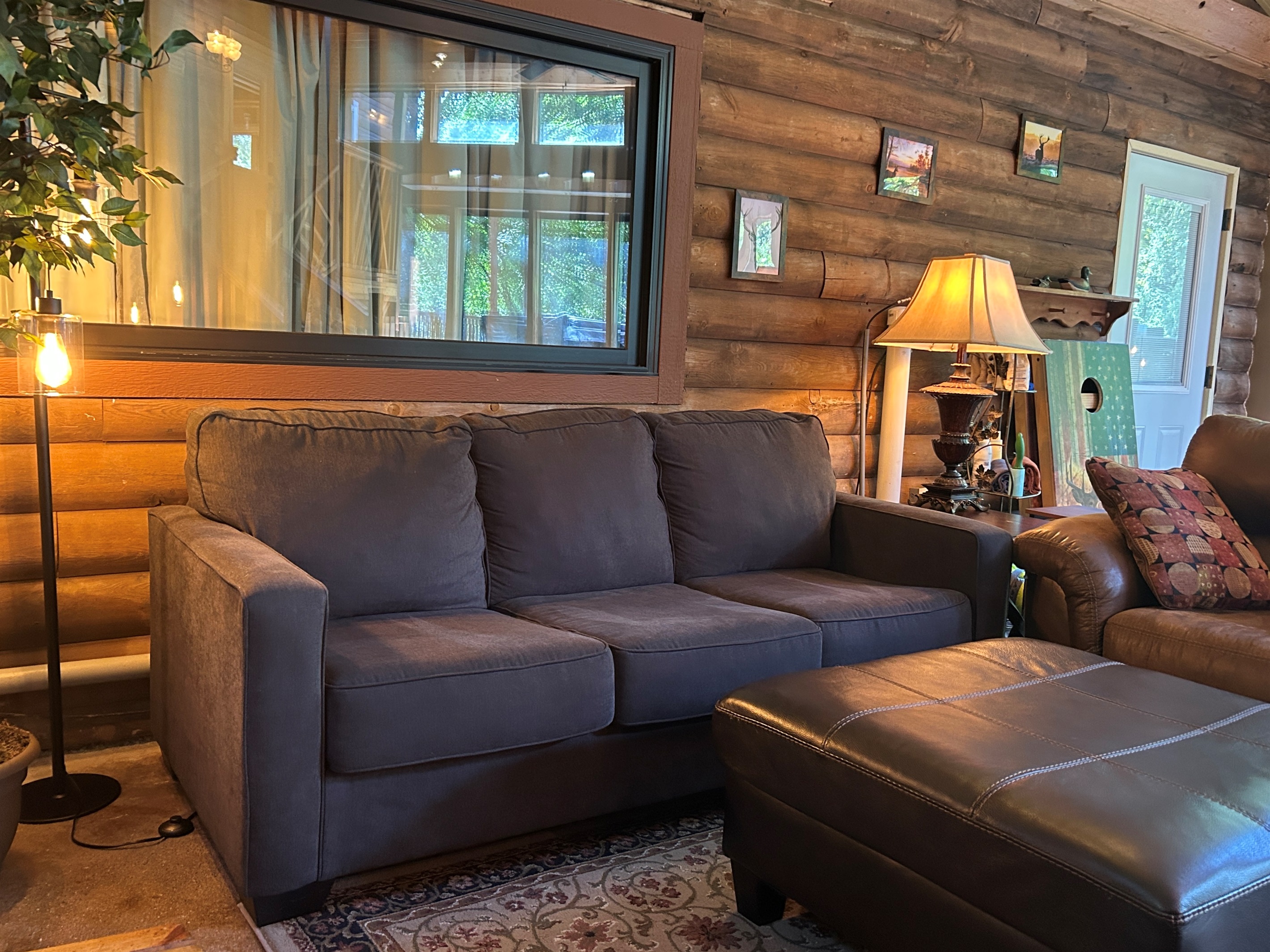 Window above couch can be curtained off or opened for for open line of sight to the Guest Quarters. The door to the Guest Quarters also has blinds that can be opened or closed for privacy.