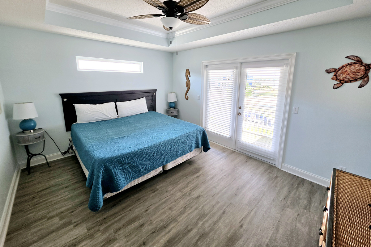Primary bedroom with king bed and French doors