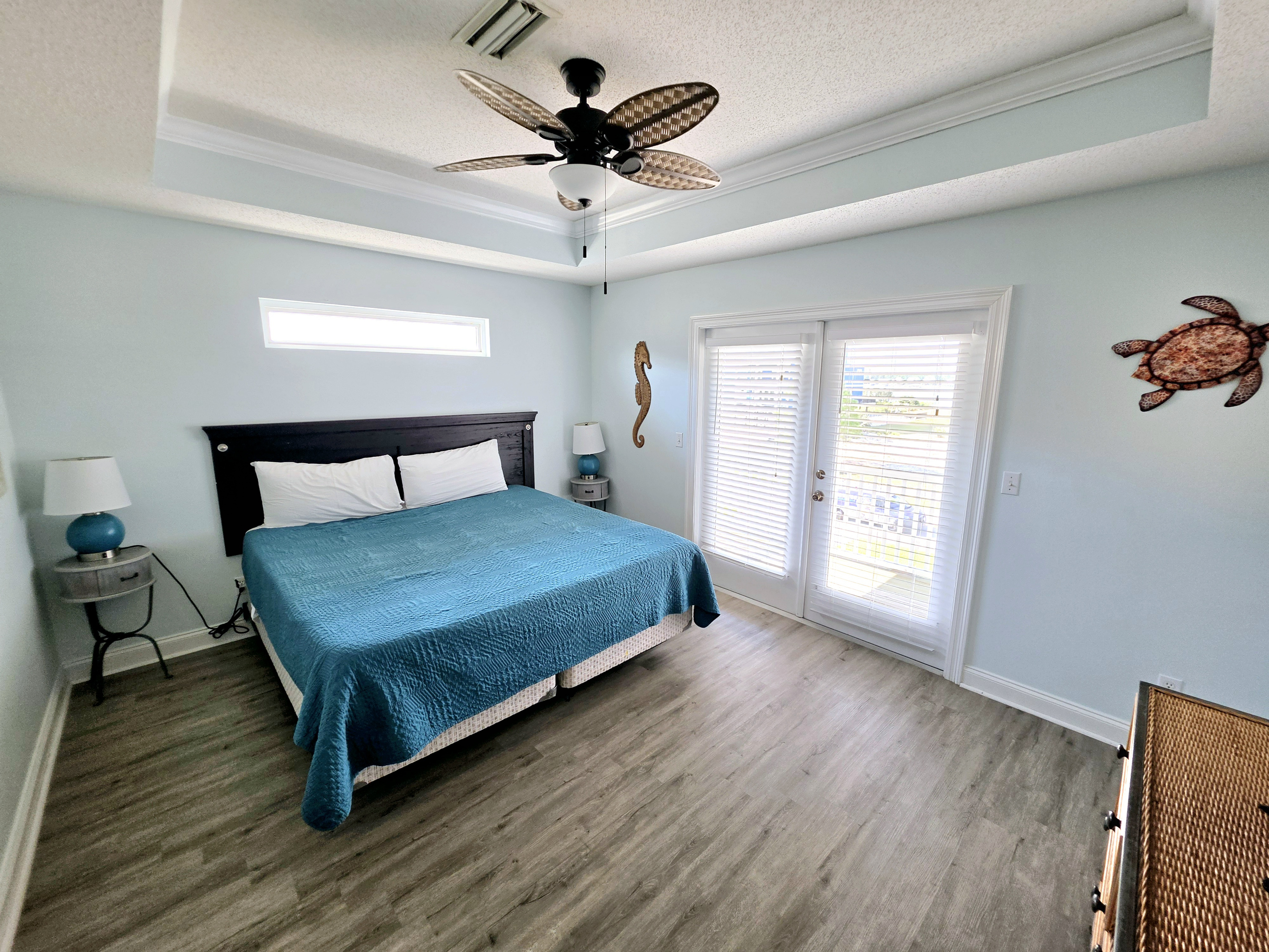 Primary bedroom with king bed and French doors