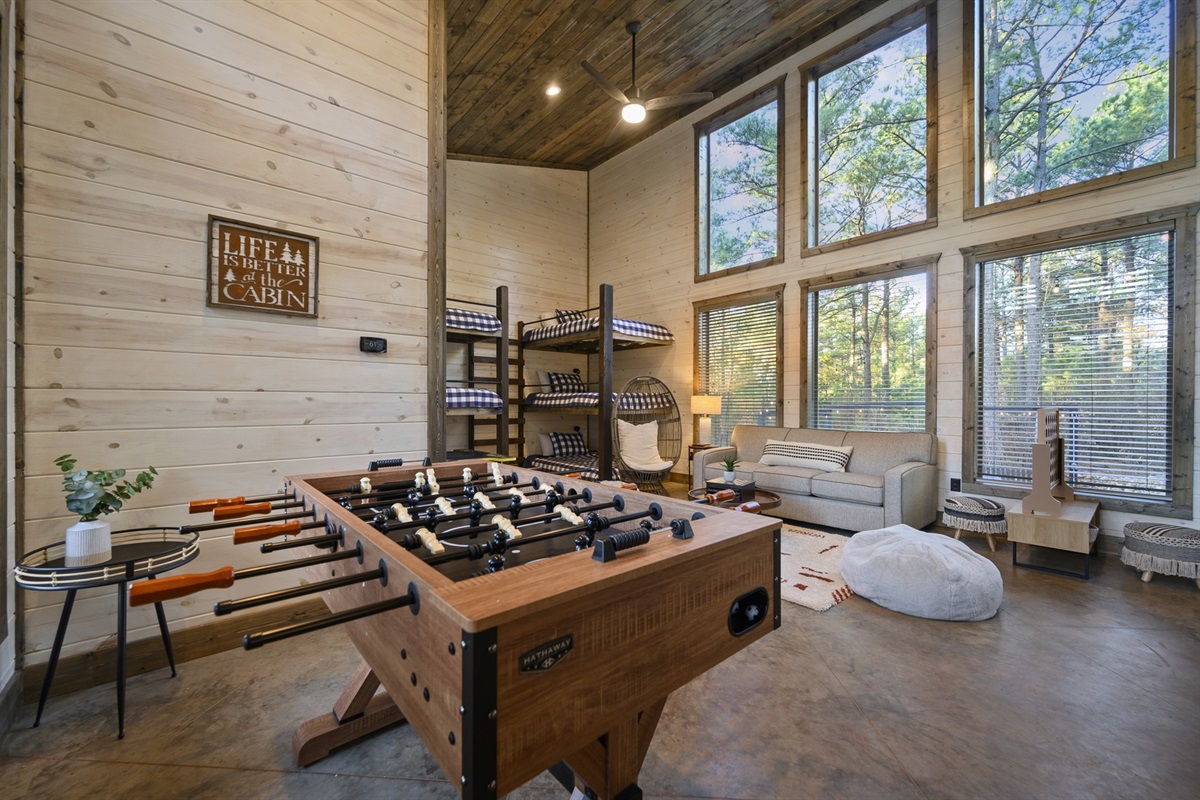 Challenge friends to foosball, hang out in the bunkhouse, or just unwind with forest views and cozy cabin vibes all around.