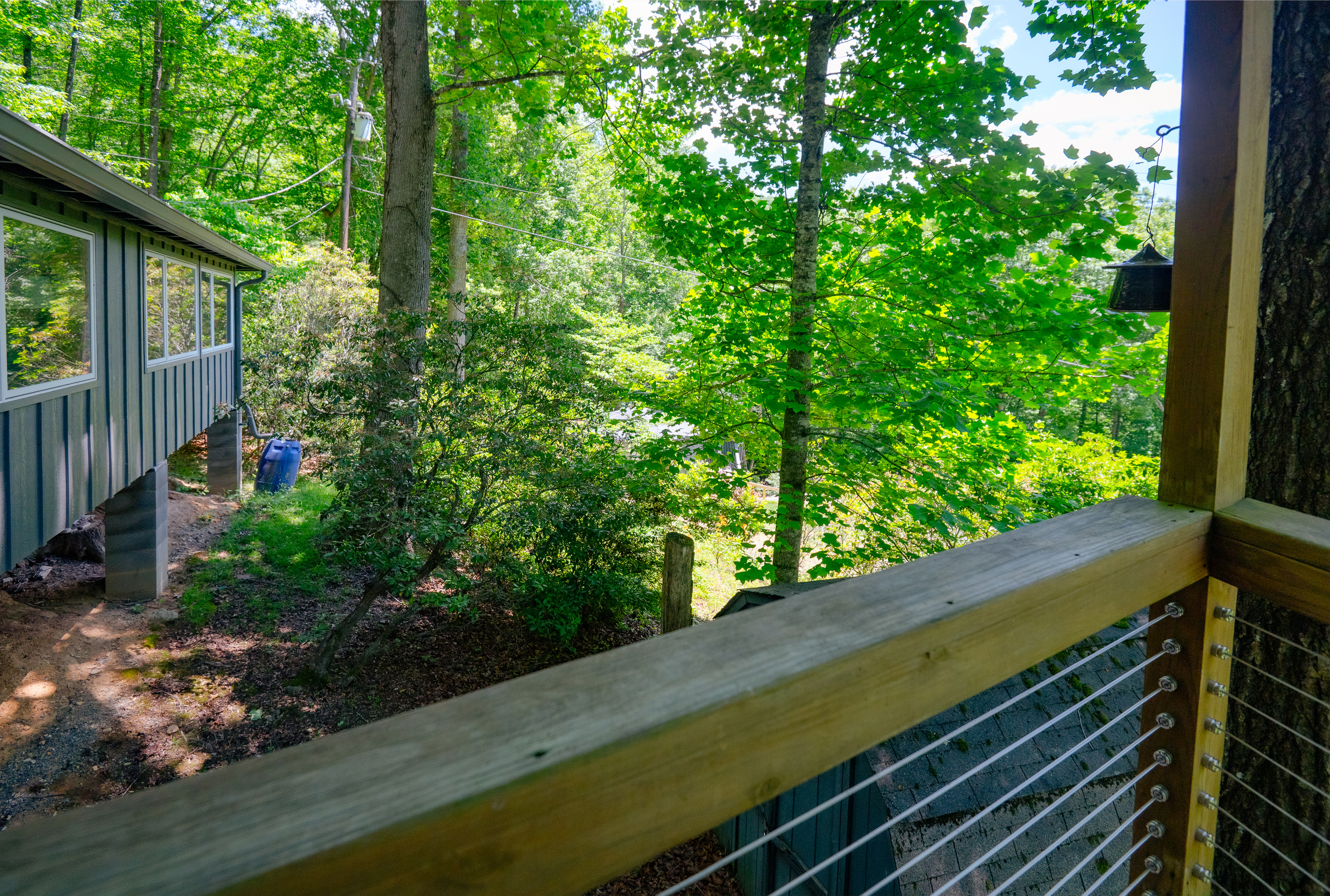 View to the left side of the house; privacy from the neighboring house