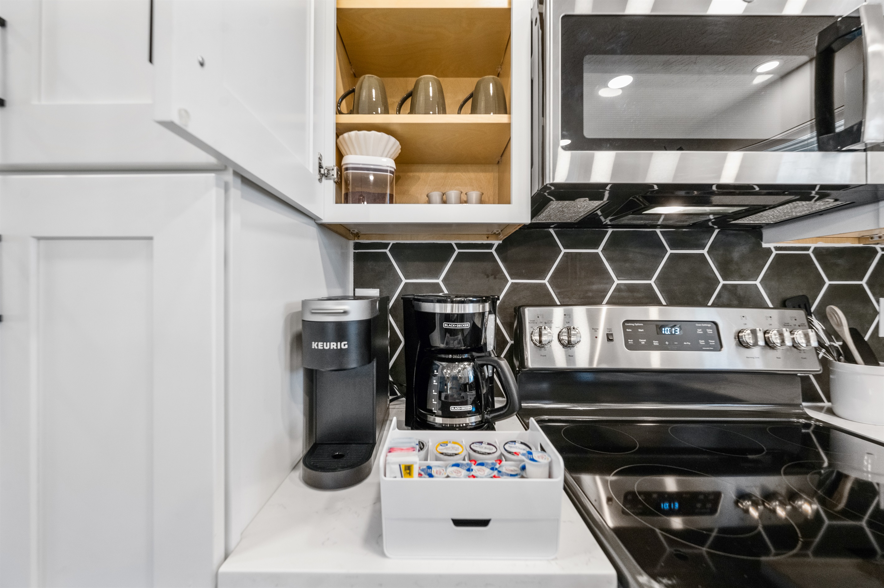 Start your morning right with a drip coffee maker and Keurig, plus a complimentary starter supply of coffee, filters, assorted pods, creamers, and sweeteners.