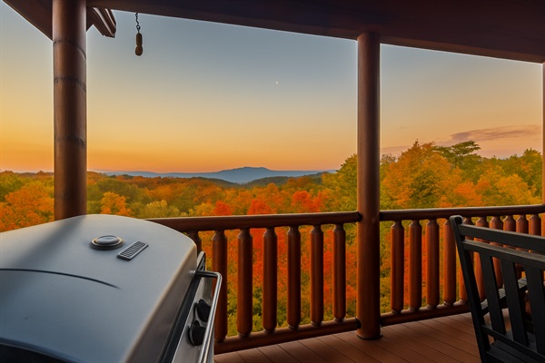 Enjoy the fall beauty from the upper deck, as lights begin to twinkle from nearby Pigeon Forge and Mount LeConte.