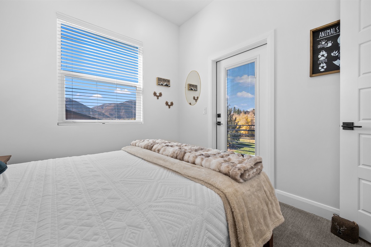 Peaceful upstairs bedroom with elegant décor and soft lighting.
