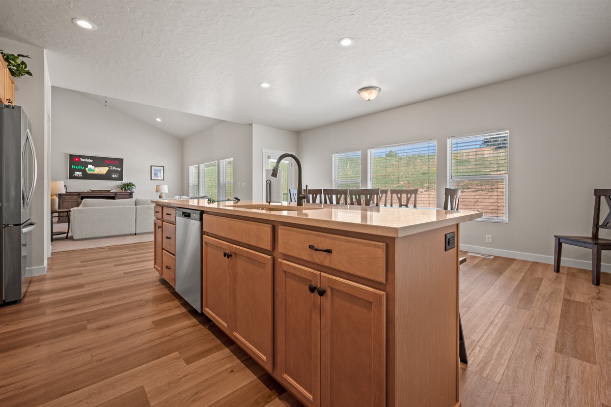 The spacious open layout keeps everyone connected, whether you're preparing meals, eating, or lounging in the living room.