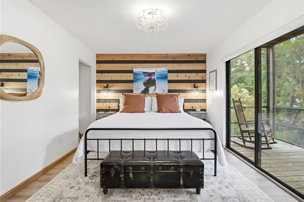 King bedroom with balcony and views of the canal