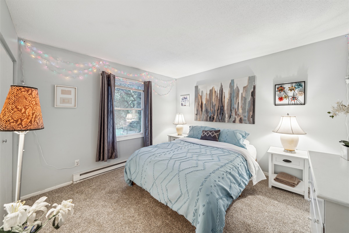 Enjoy the beautiful upstairs queen bedroom overlooking the neighborhood.