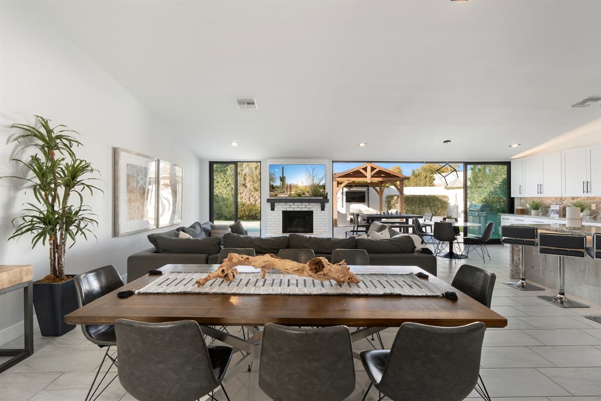 Open-concept dining with indoor-outdoor flow.

