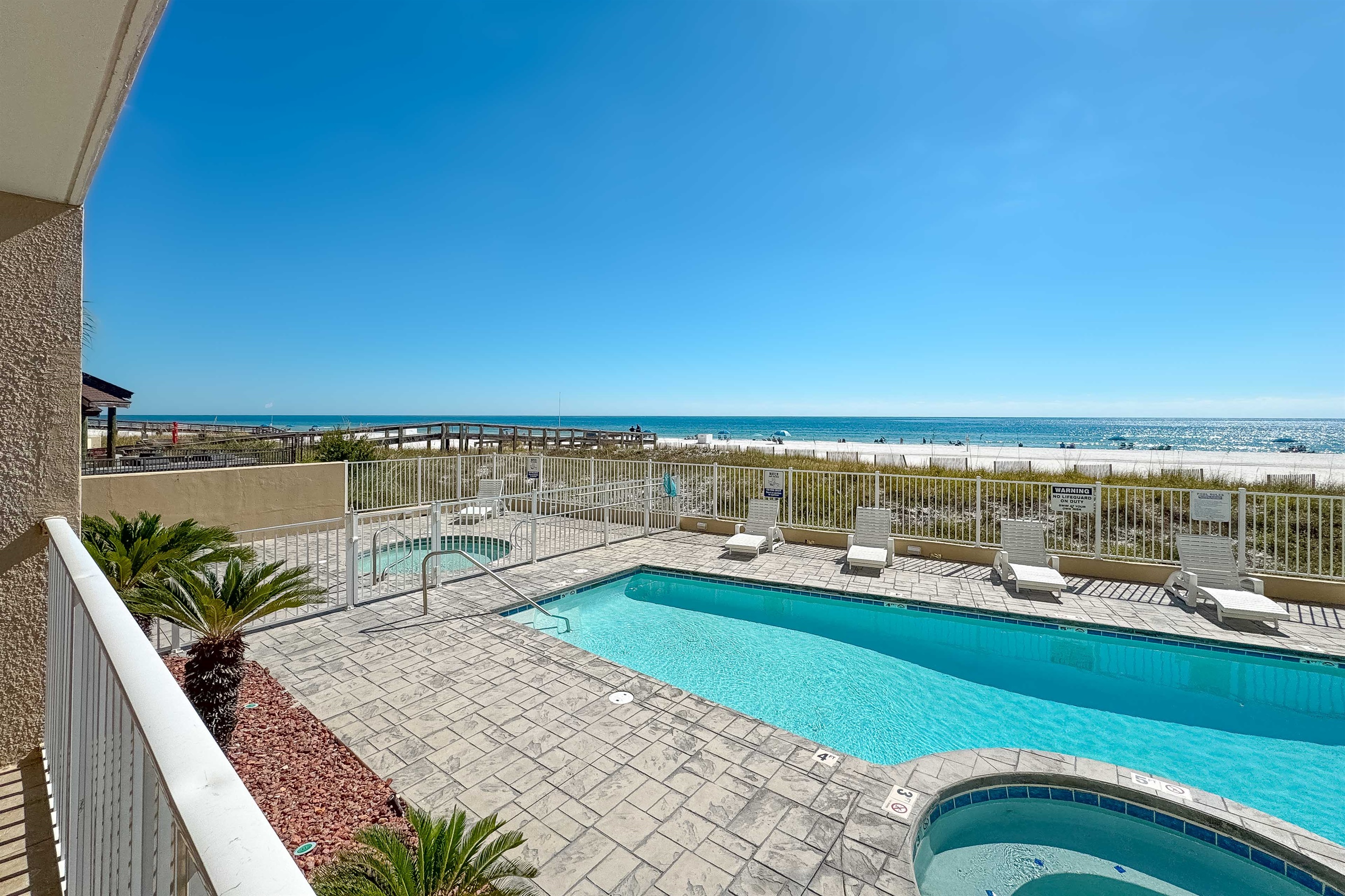 Dive into relaxation with our sparkling adult pool and fenced kiddie pool, just steps from the sandy beach.  Unwind and soak up the sun in paradise.