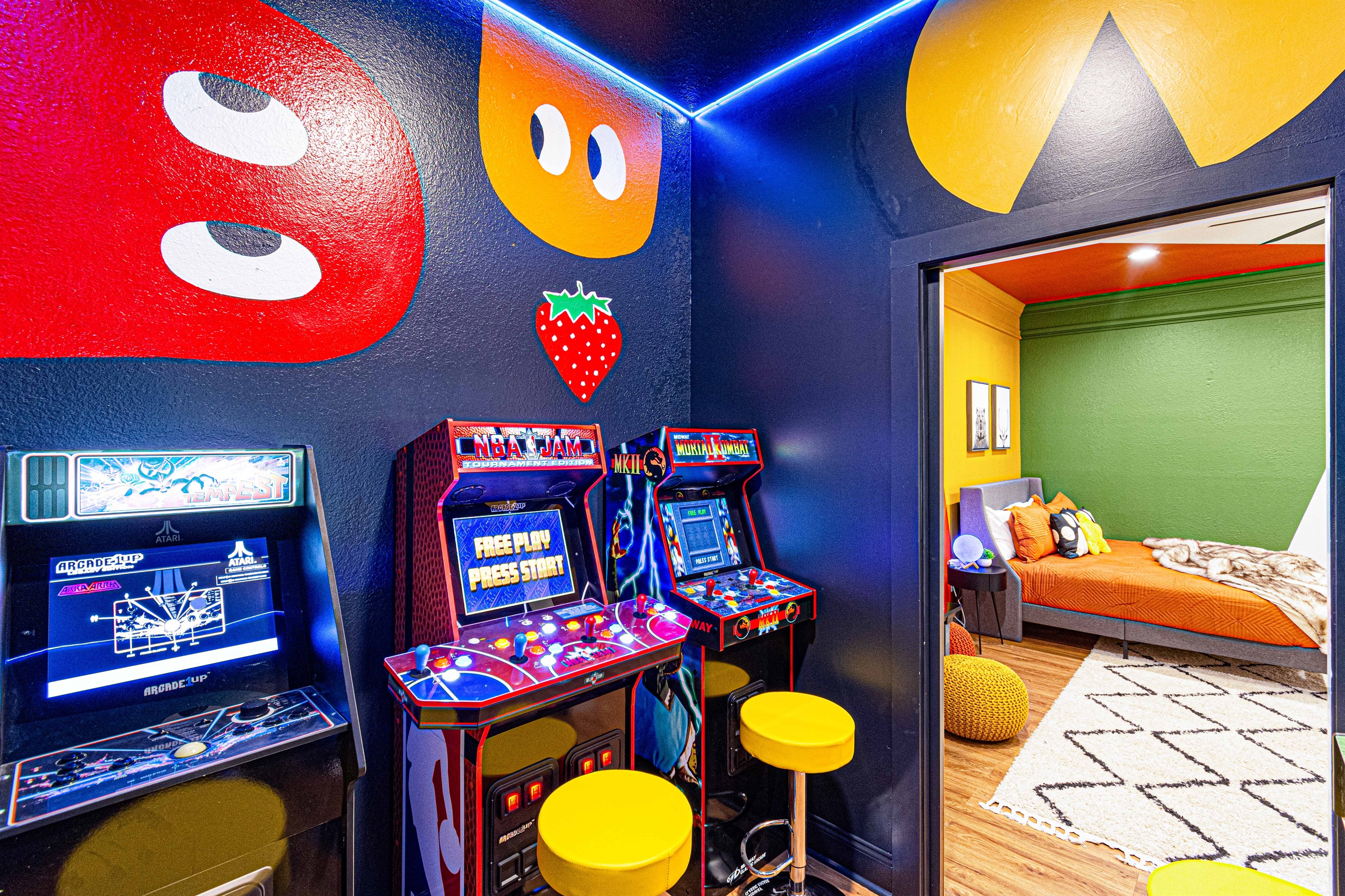 Step into nostalgia in our vibrant arcade room! Featuring classic Pac-Man murals and six standing game favorites, this space is perfect for a retro gaming session. Grab a stool, challenge your friends, and relive the golden age of arcade fun!