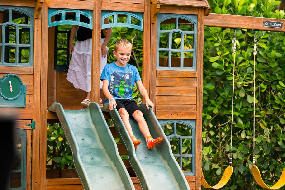 Safe, shaded area for little ones to swing, slide, and explore while adults relax nearby.
