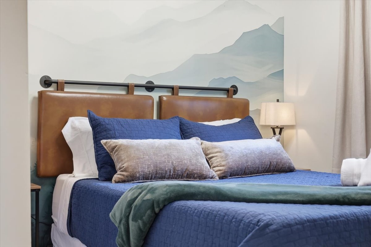 Queen-size memory foam, blackout-quiet and a bladeless fan for the perfect sleep temperature, this room means business