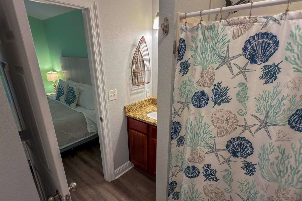 From the soothing beach-inspired color scheme to the playful coral patterns, this space captures the carefree spirit of coastal living.