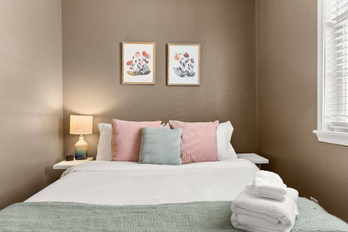 The "Brown" bedroom has a comfy queen bed, closet, plenty of pillows, and everything for a restful stay