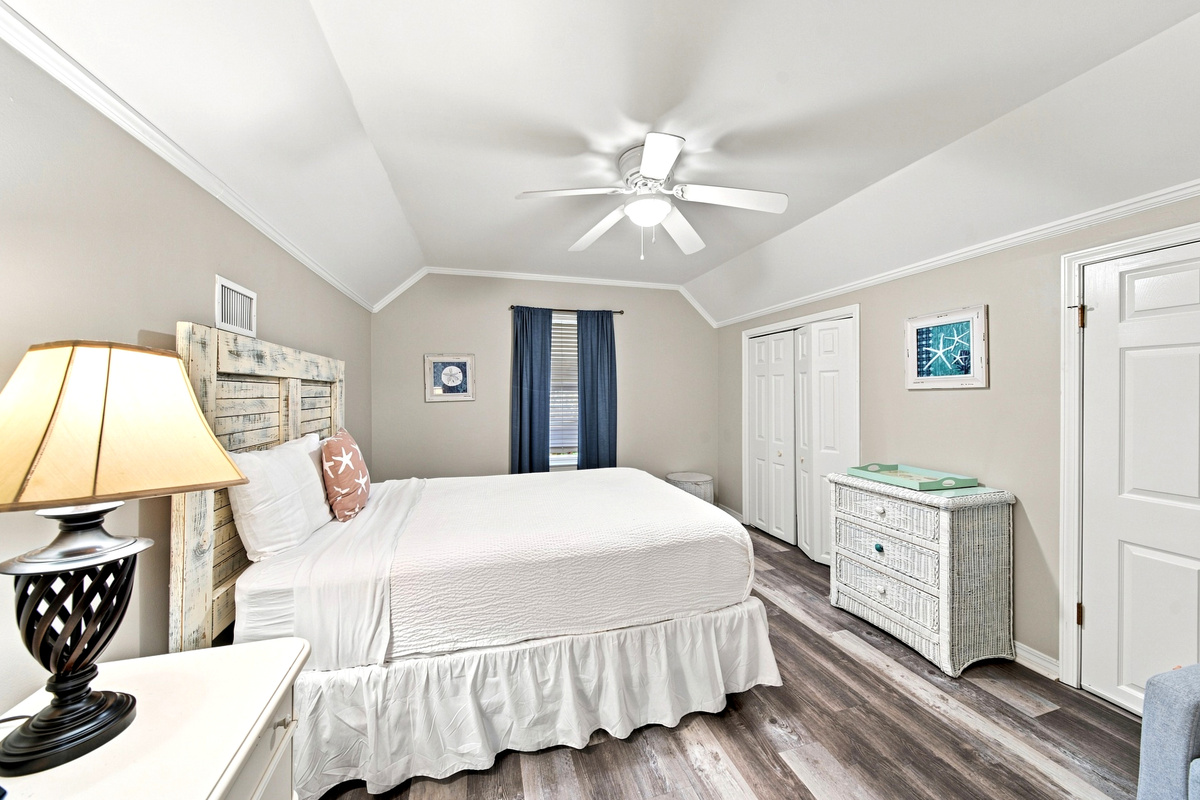 The third bedroom offers a comfortable queen bed and its own dresser for extra storage.