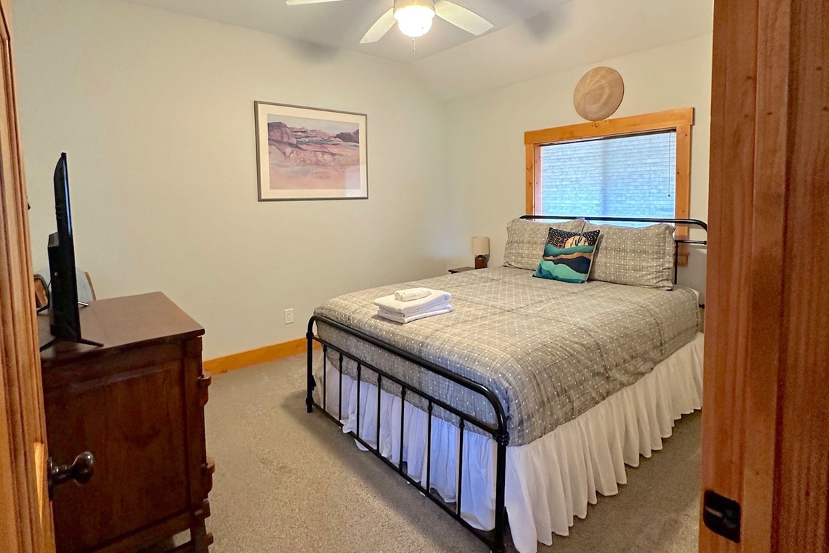 Unit B Bedroom #3 with queen bed and TV