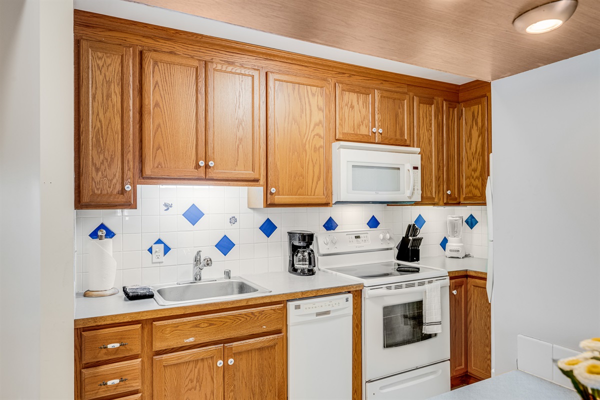 Nice bright kitchen with all the basics to cook up yummy island meals!
