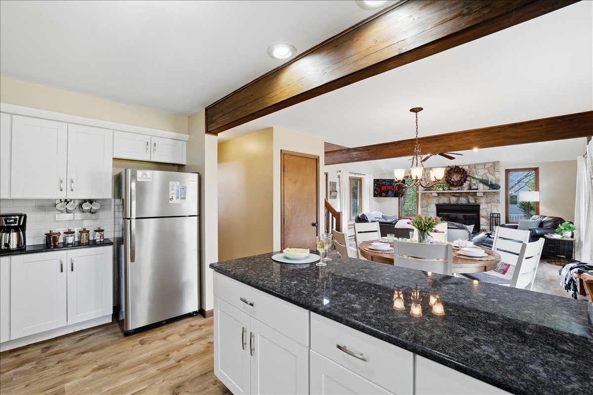 Cook with ease in the fully stocked kitchen featuring an open-concept design perfect for gathering