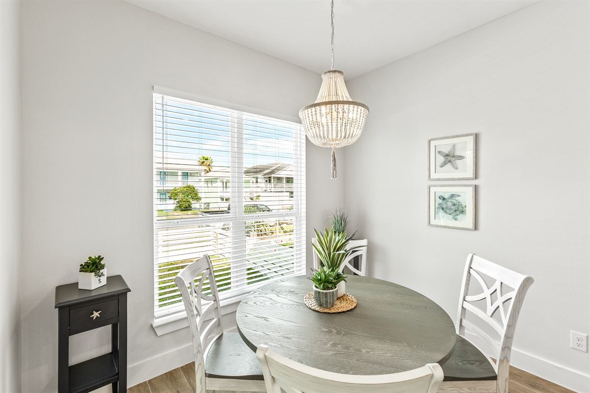 Seating for 4 around the dining table.  See the water from the window!