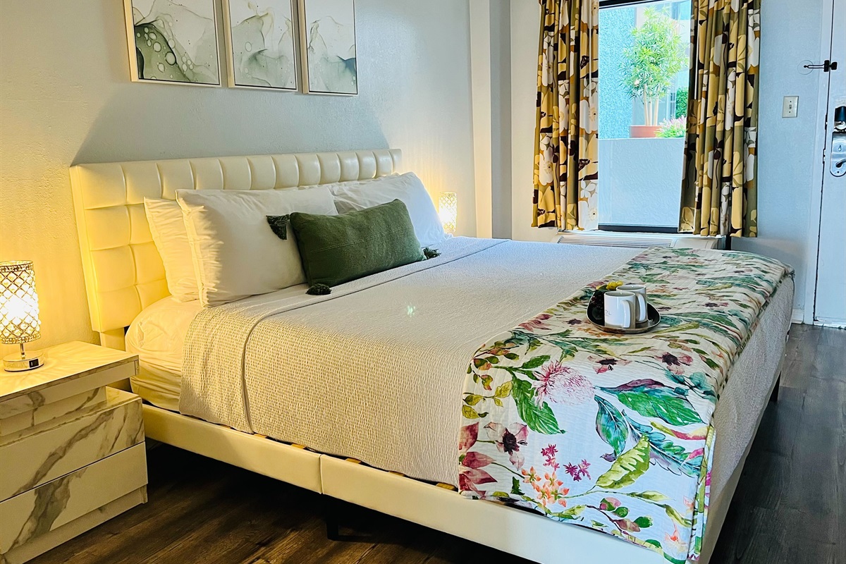 Discover charming coastal decor accents that adorn the bedroom, seamlessly blending the indoor space with the beauty of the ocean just beyond.