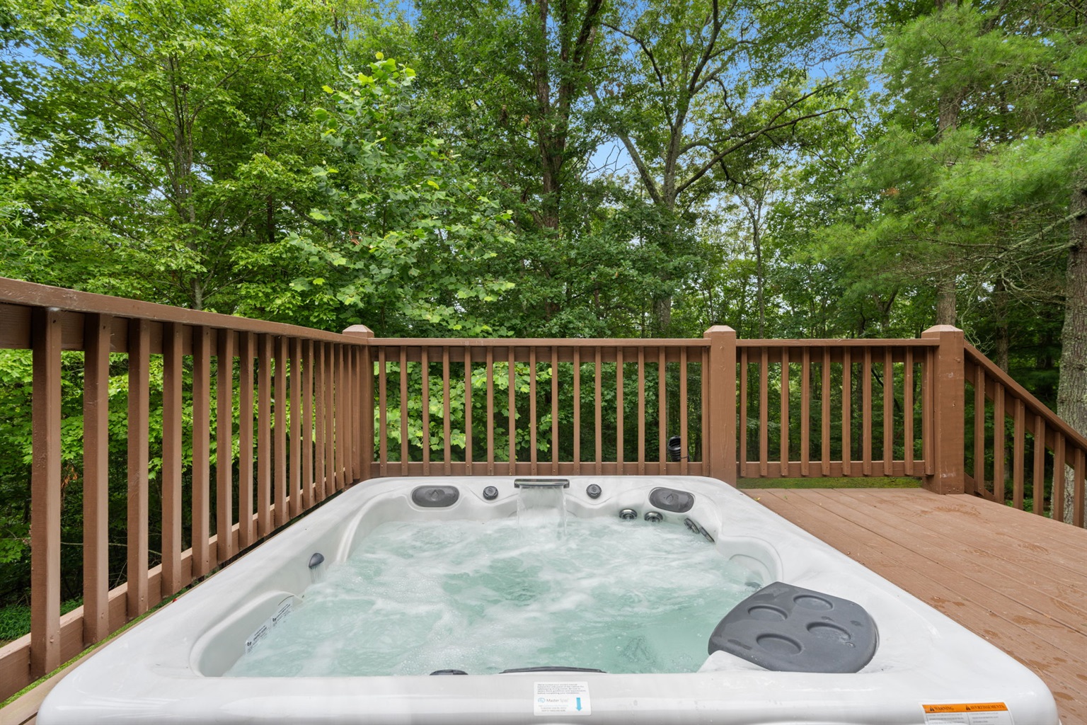 Hot tub located on the deck ready for you after a long trip