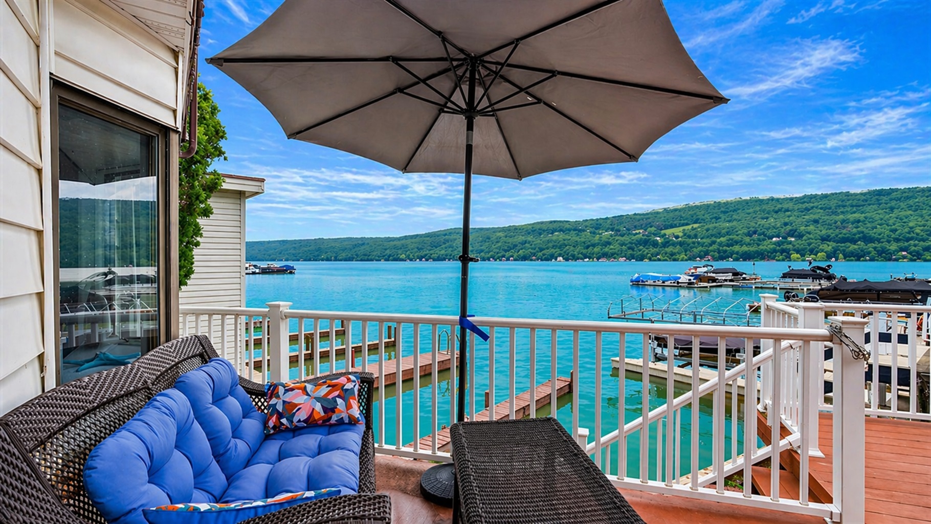 Relax on the cozy lakeside patio with stunning water views and a shaded spot to unwind. Perfect for a peaceful retreat!
